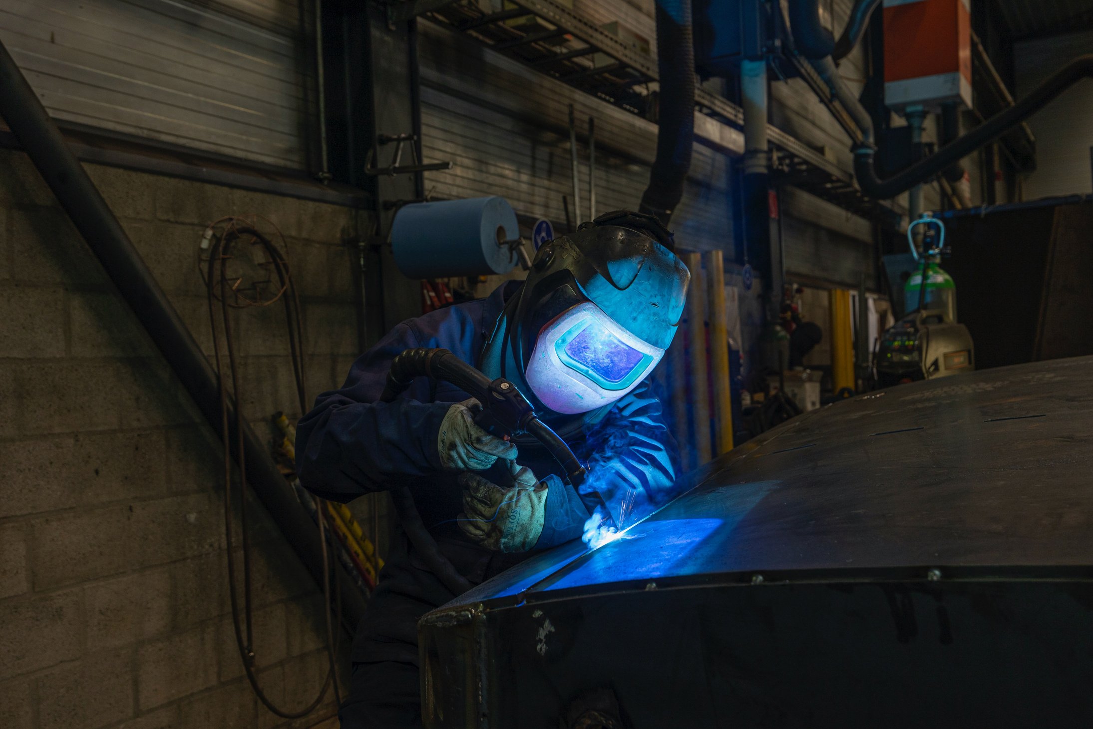 Person Welding a Metal